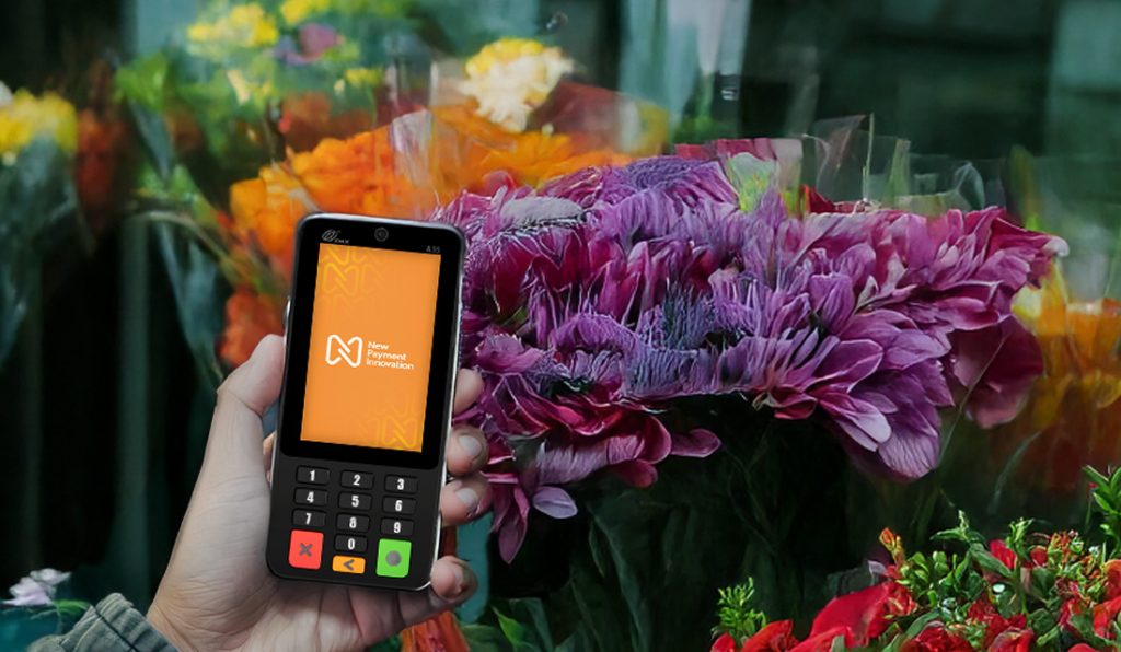 Card machine Ireland: small business owner using A35 payment terminal in Dublin flower shop for contactless transactions